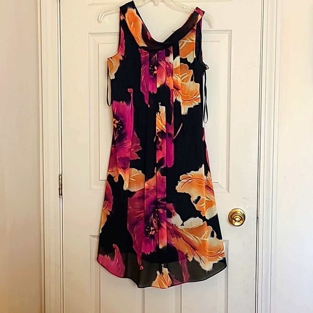 Sleeveless dress with large floral print on black